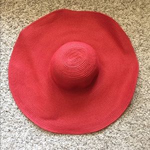 large red floppy hat